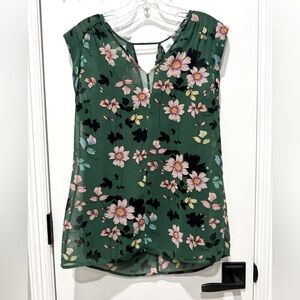 Lightweight, sleeveless top. Two for one - removable black tank underneath.